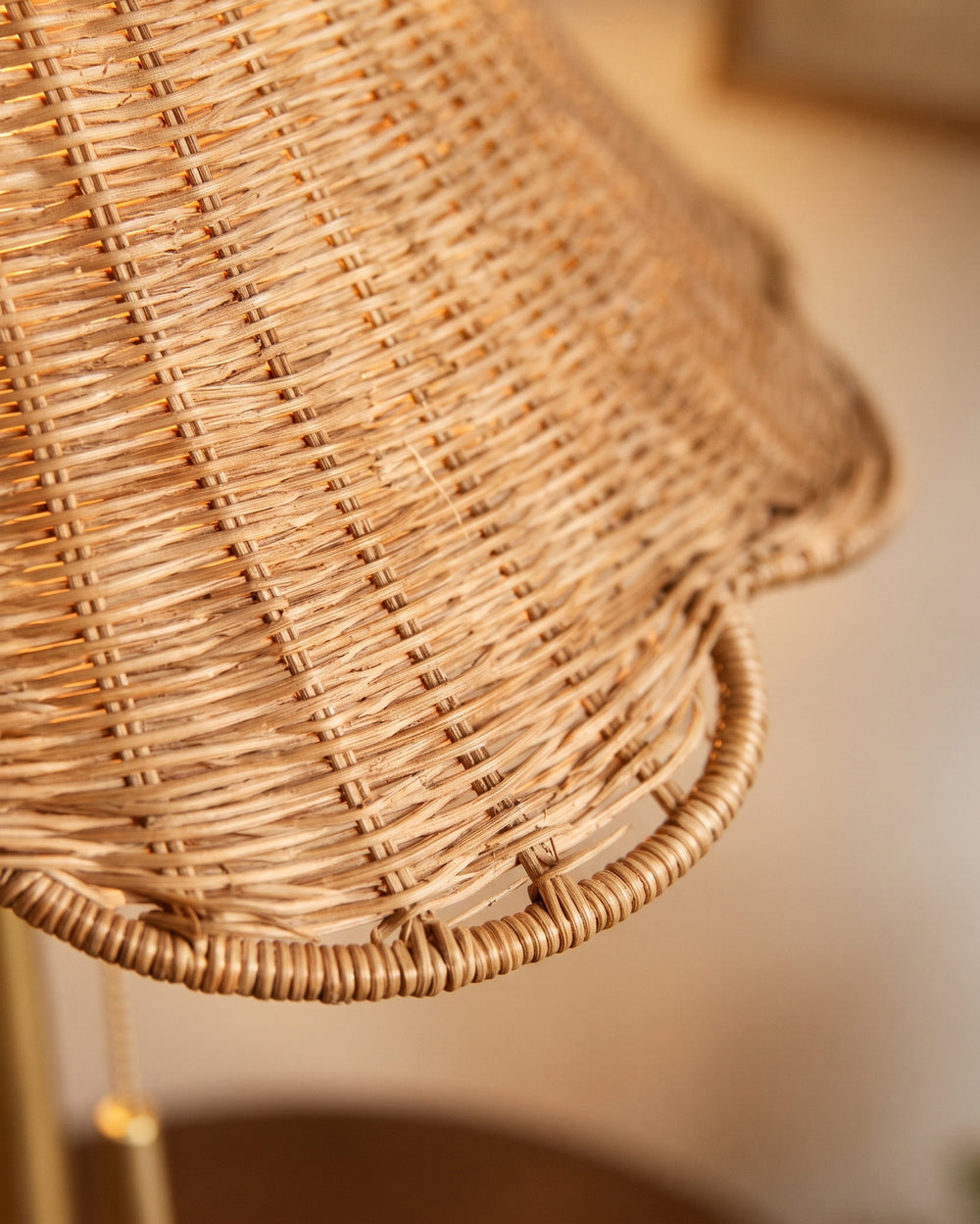 Woven rattan pendants glowing in a warm room